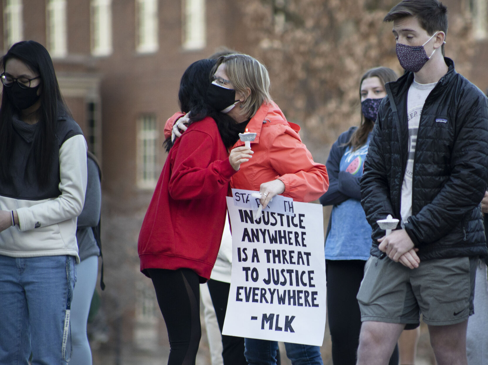 Honoring Atlanta Victims Vigil, Attendees Hug